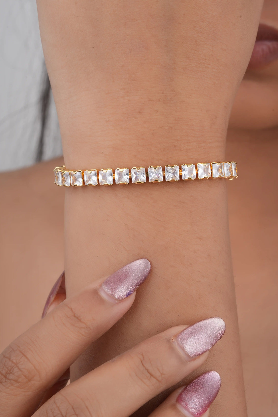 TooBela gold color tone plated square crystal tennis bracelet on woman wrist