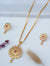 TooBela gold tone floral pendant necklace set with ruby color stone and crystal detailing