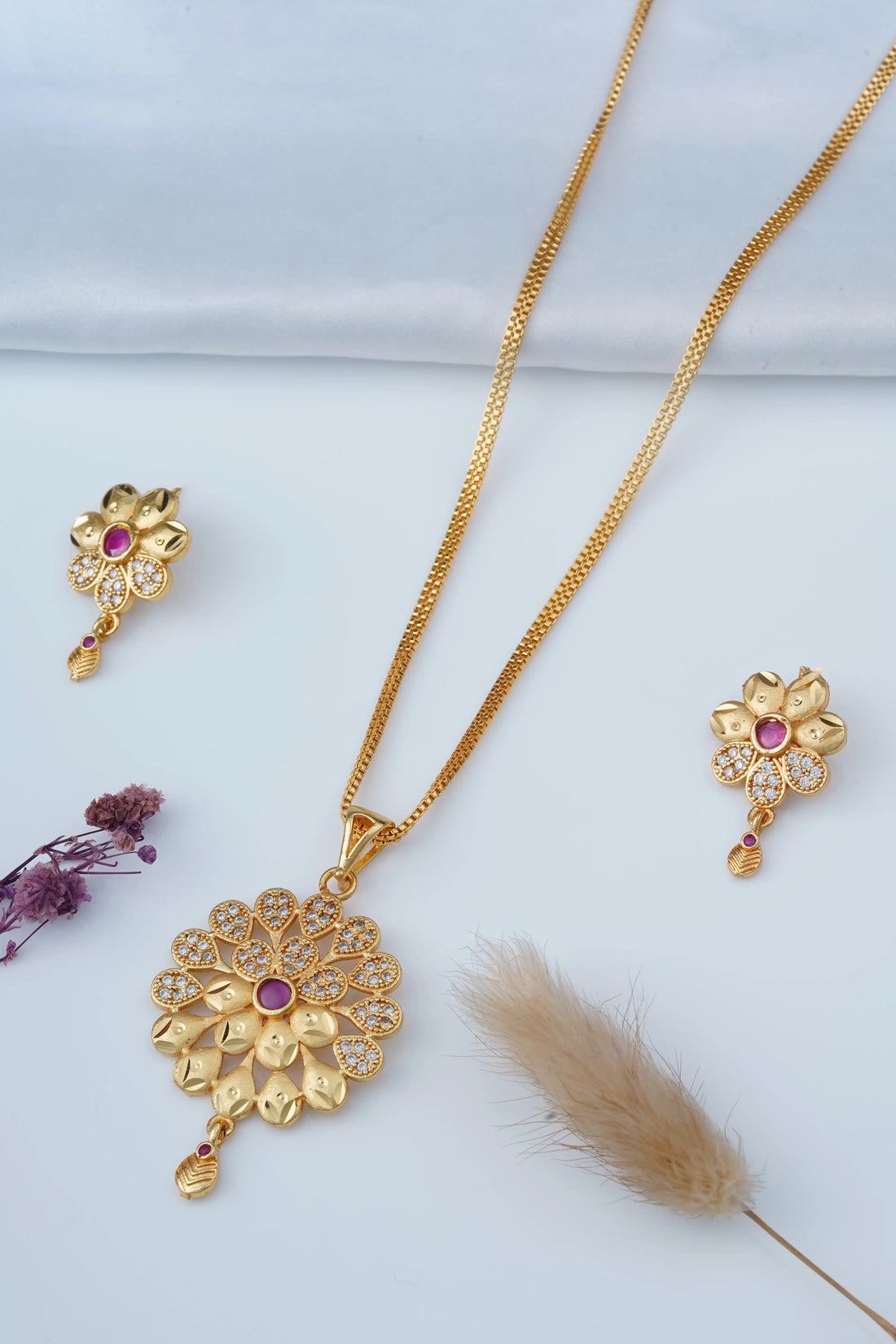 TooBela gold tone floral pendant necklace set with ruby color stone and crystal detailing