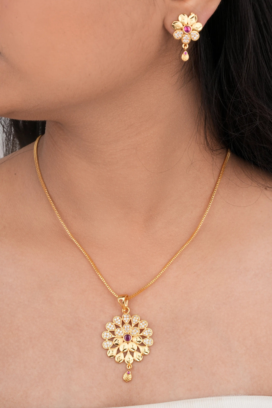 TooBela gold tone floral pendant necklace set with ruby color stone and crystal detailing